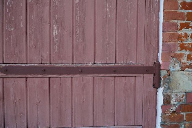 Texture of an old fence made of wooden boards closeup