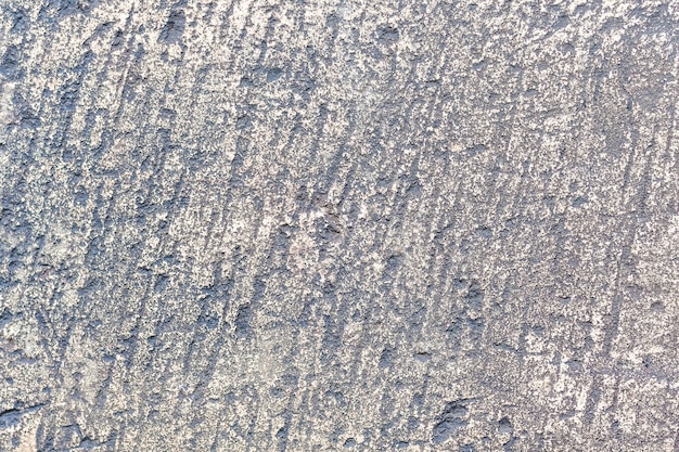 The texture of an old gray processed stone