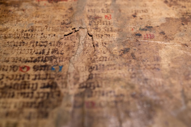 Texture of an old manuscript with a damaged surface