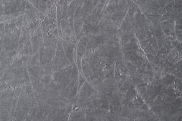 Texture of old metal with scratches and cracks silver plate metal background