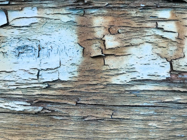 Texture of the old old rotten cracked dilapidated dilapidated painted swollen paint of a peeling