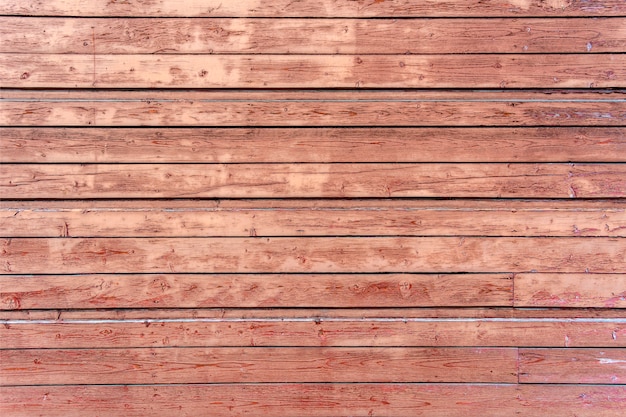 Texture. Old painted wall of the house. Old wooden fence.