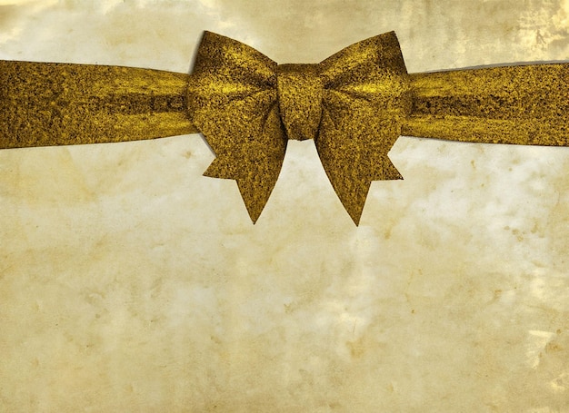 Photo texture of old paper in golden hue bow black