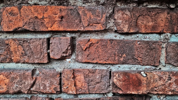 Texture of old red brick wall closeup