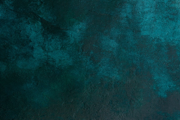 Foto strutturi il vecchio colore verde scuro del muro di cemento di pietra con le crepe, fondo