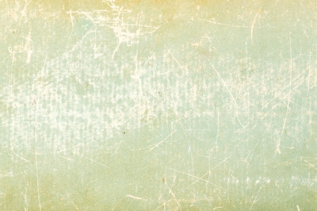 Photo texture of old vintage green book cover textured scratched cardboard
