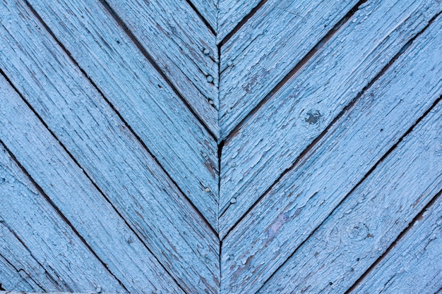 Texture of old wood with worn blue paint