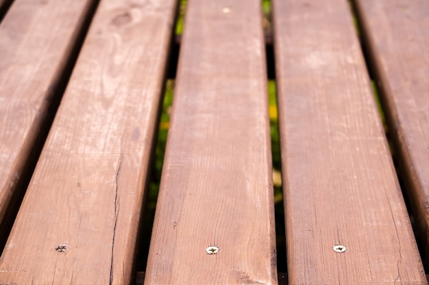 Texture of old wooden brown painted bridge floor abstract background.