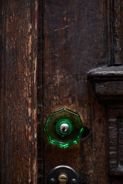 Texture of old wooden door with green handle