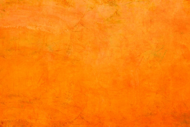 Foto struttura del fondo arancio del muro di cemento.