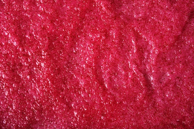 Texture of organic berry scrub with sugar and seeds Closeup