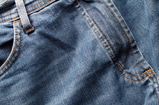 The texture of a pair of jeans showing the front Top view and close up photo