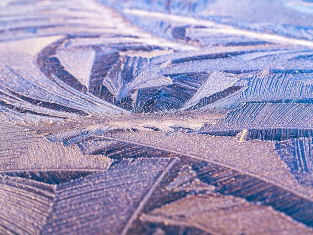 The texture of patterns of frost on the glass in winter