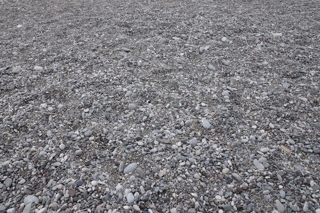 Texture of pebbles from the sea shore bank beach