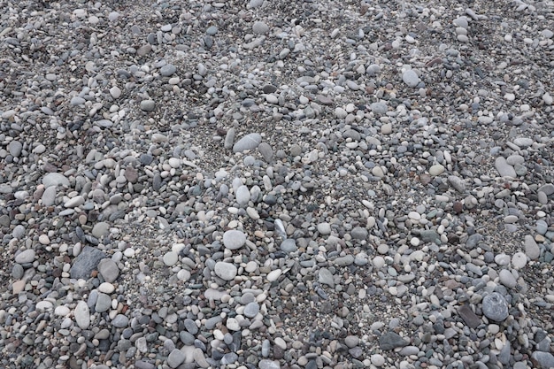 Texture of pebbles from the sea shore bank beach