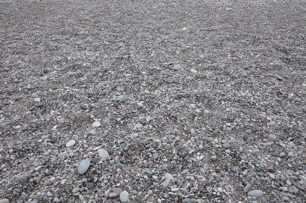 Texture di ciottoli dalla spiaggia della riva del mare