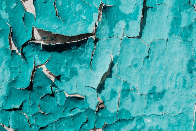 Photo the texture of peeling paint and cracked wall