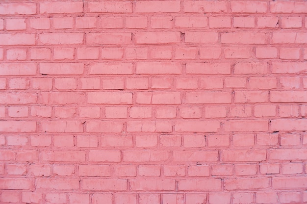 Texture of a pink brick wall at home.