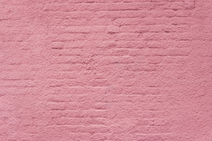 Photo texture of a pink brick wall.