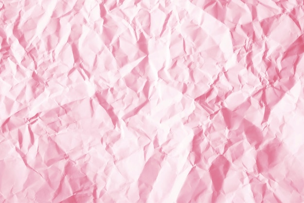 Texture of pink crumpled paper for background