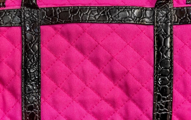 Photo texture of pink fabric with leather inserts