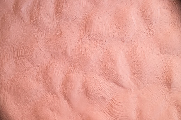 Texture of pink plastered wall