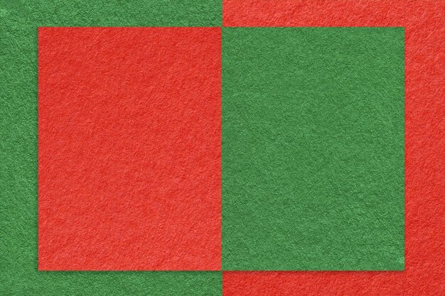 Texture of red and green paper background with geometric shape and pattern macro Structure of craft cardboard