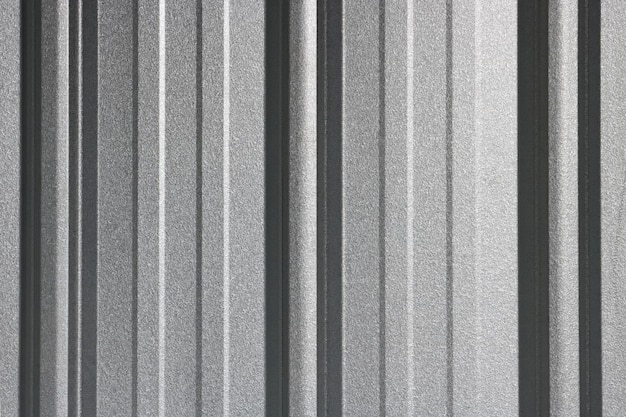 壁の金属板の抽象的なパターン背景の屈折の質感