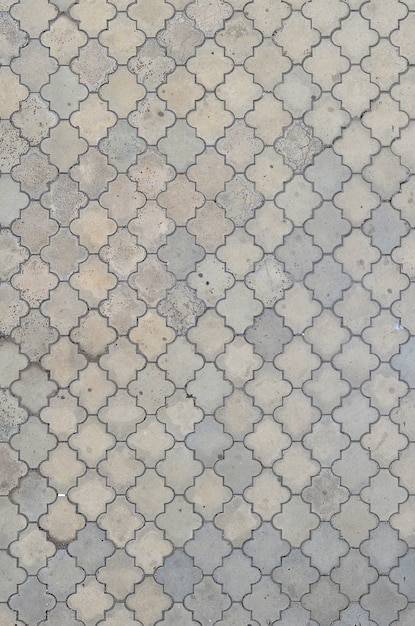 The texture of a rhythmic mosaic made of concrete tiles.