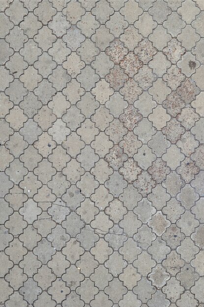the texture of a rhythmic mosaic made of concrete tiles. 