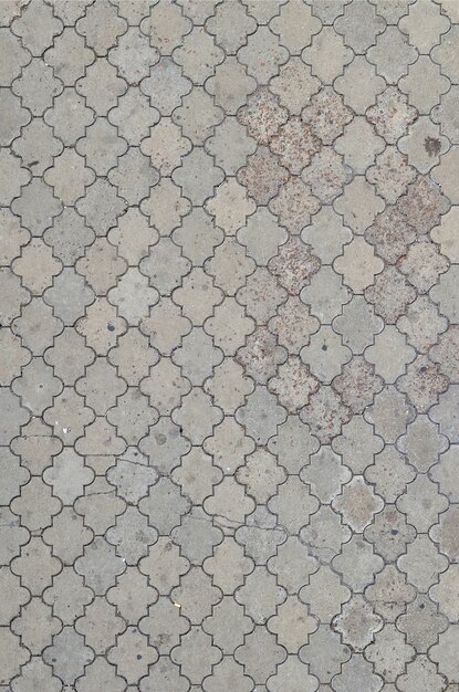 The texture of a rhythmic mosaic made of concrete tiles. 