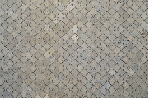 The texture of a rhythmic mosaic made of concrete tiles.