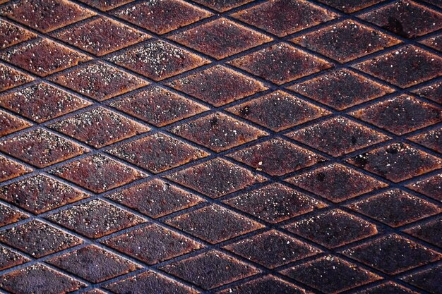 Photo texture of rusty metal surface with rhombic shapes