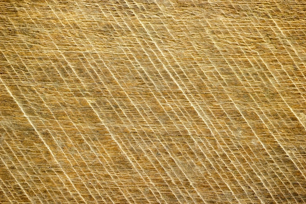 Texture of the saw on real natural brown wood.