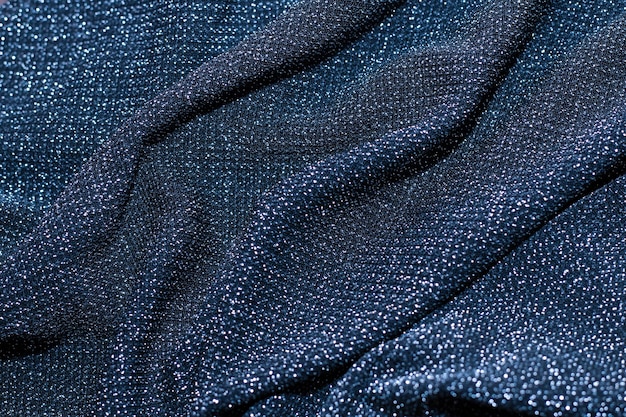 Texture of shiny sparkling lurex fabric blue color