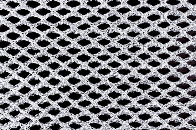 Texture of silver acrylic fabric in mesh close-up