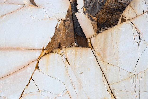 Texture of smooth cracked stone in orange color sandstone close up for background