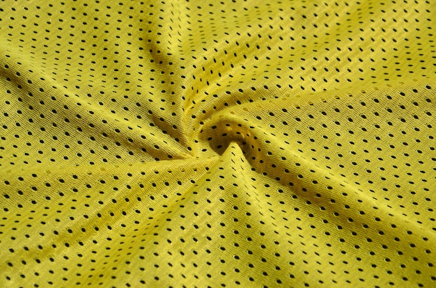 Текстура спортивной одежды из полиэфирного волокна. Верхняя одежда для спортивных тренировок имеет сетчатую текстуру из эластичной нейлоновой ткани