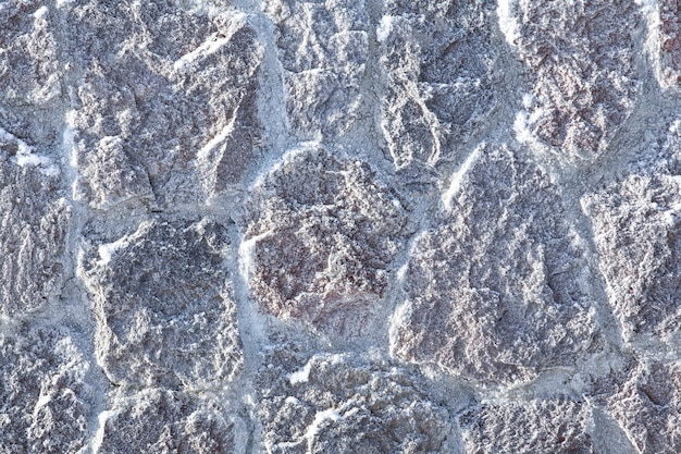 Texture stone wall and snow