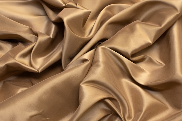 The texture of the synthetic fabric is light brown. 