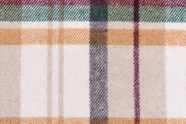 Photo texture of a traditional scotch check in beige yellow and green colors closeup tartan for shirts and warm clothes image for your design
