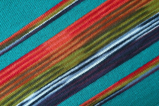 Texture of Turquoise Blue with Red and Green Striped Alpaca Knitted Wool Fabric