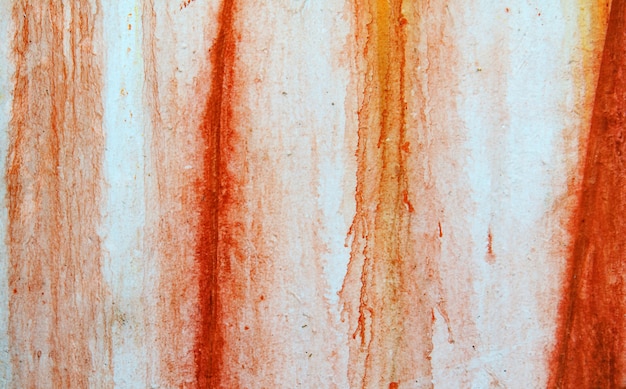 Texture of vintage rusty white iron wall background with blood-like paint streaks