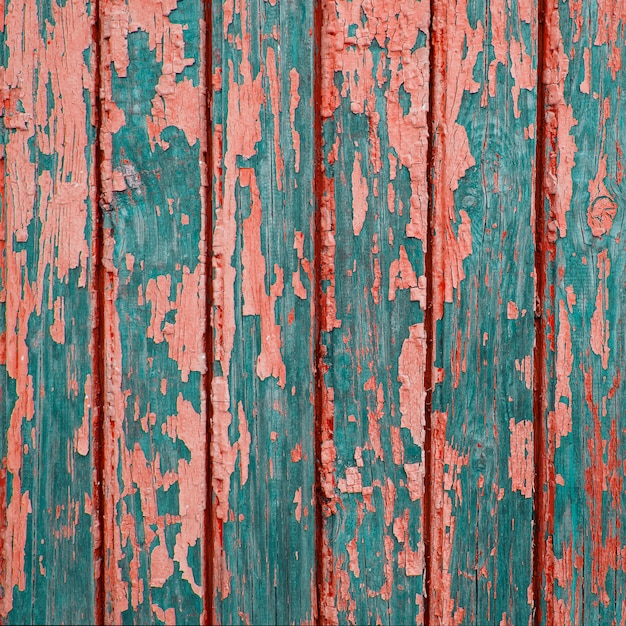 Texture of vintage turquoise painted wooden background with layers of paint