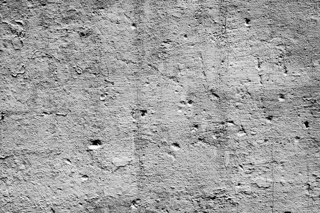 Texture, wall, concrete background. Wall fragment with scratches and cracks