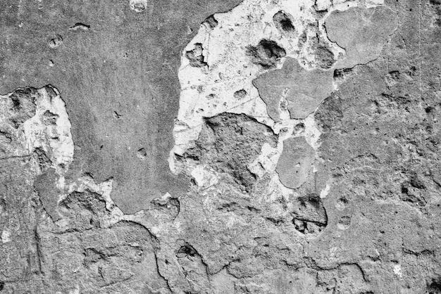 Texture, wall, concrete background. Wall fragment with scratches and cracks