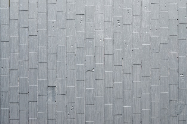 The texture of the wall from the old tile, painted gray