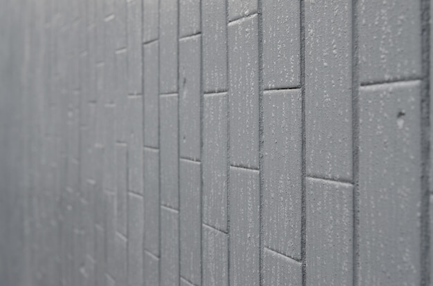 The texture of the wall from the old tile, painted gray