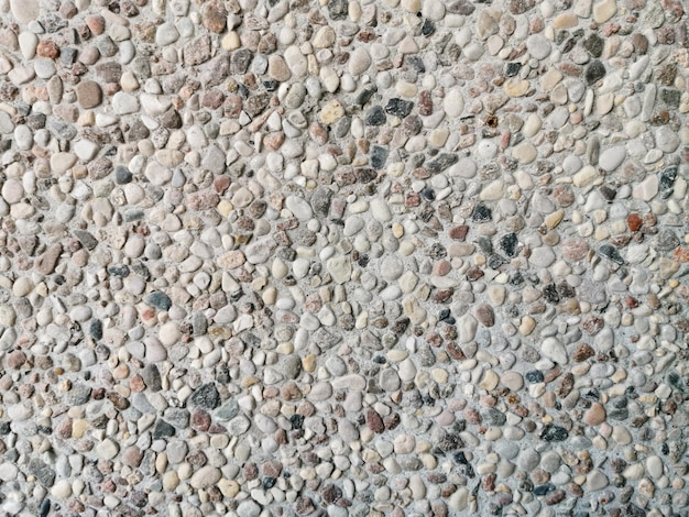 The texture of the wall of small stones