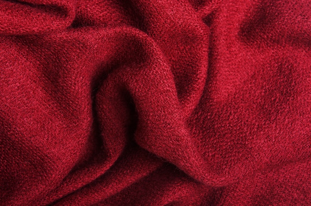 The texture of warm knitted burgundy linen